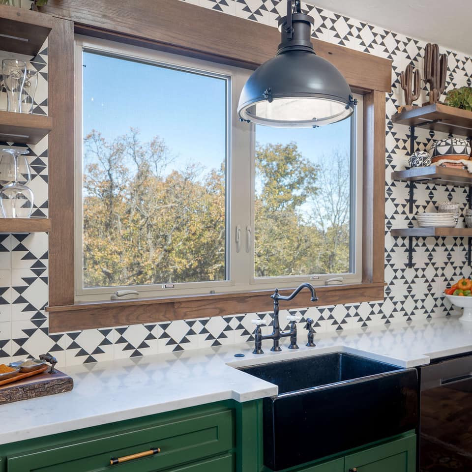 Black farm sink with outdoor view