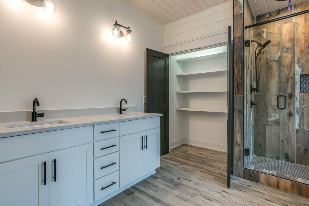 Master bathroom with sink and closet